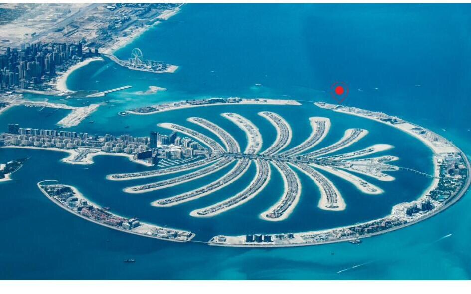 Aerial photograph of Palm Jumeirah with the SLS Residences location pinned on the Western Crescent